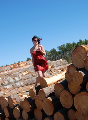 Sabrina Flashing by the Wood Pile