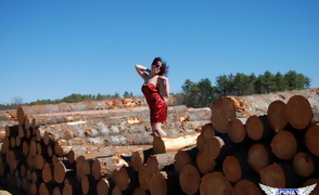 Sabrina Flashing by the Wood Pile