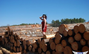 Sabrina Flashing by the Wood Pile