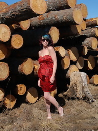 Sabrina Flashing by the Wood Pile