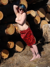 Sabrina Flashing by the Wood Pile