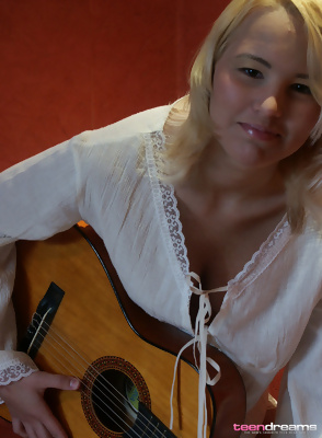 Cute Blonde Playing Guitar Topless
